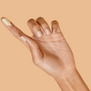 Hand with index finger extended with a smear of 54 Thrones African Beauty Butter